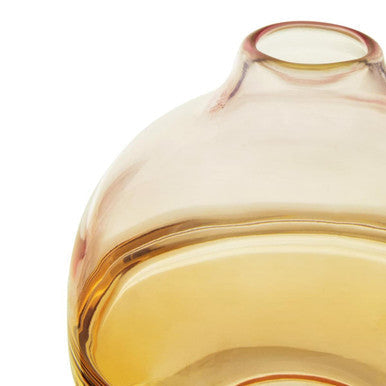 A translucent amber glass optik bottle vase with a rounded bulbous body and narrow neck perfect for decor