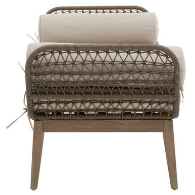 Beige cushioned opus rope woven outdoor armchair with a brown rattan frame and wooden legs for comfy seating