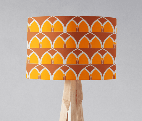 Orange and yellow geometric arches table lamp shade with bold pattern on light wooden base for floor or table lamp