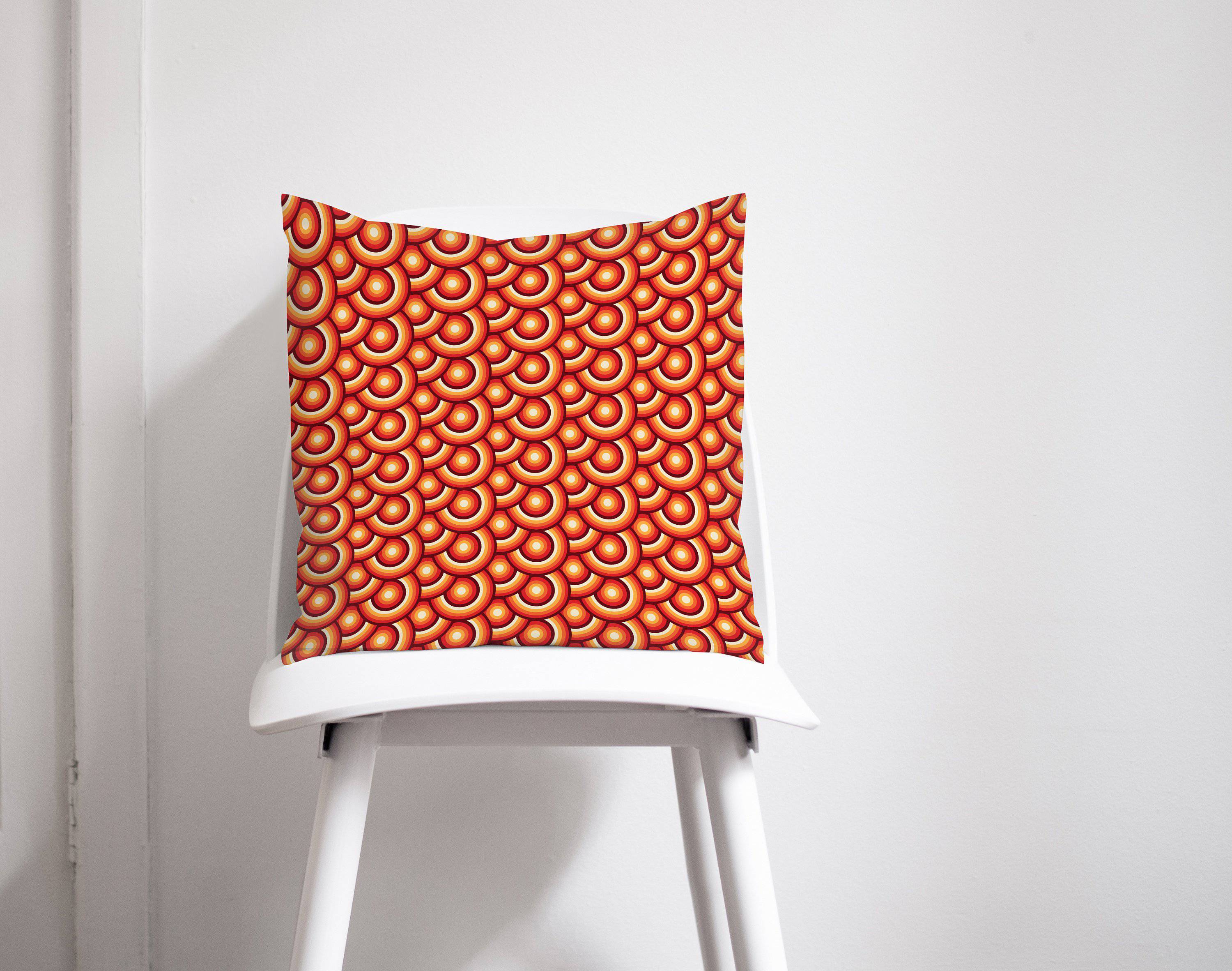 Orange throw pillow with 70s retro circles design featuring a vibrant orange circular pattern for home decor