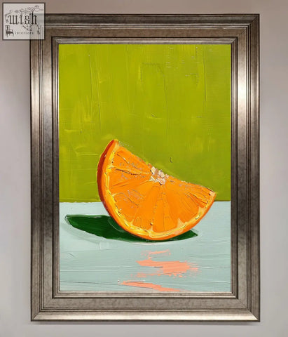 Vibrant orange wedge framed print with bright orange slice artwork in a sleek metallic silver frame perfect for décor