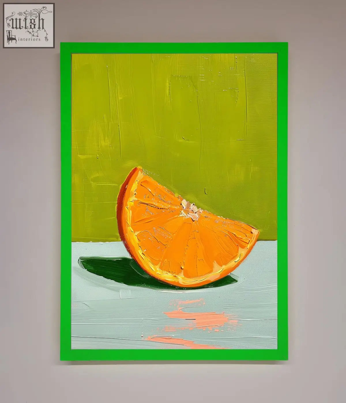 A vibrant orange wedge framed print showing a bold textured orange slice on canvas with a bright green frame