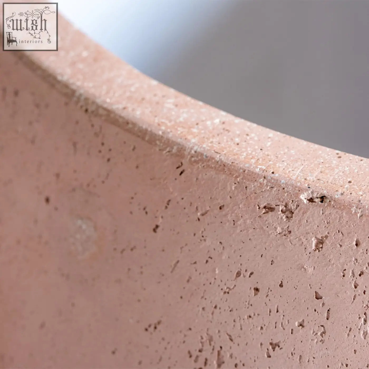 A matte pink terracotta orbello 35cm planter with a textured speckled surface perfect for plants