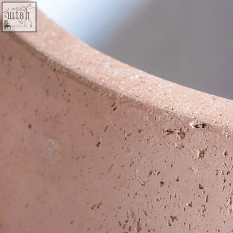 A matte pink terracotta orbello 35cm planter with a textured speckled surface perfect for plants