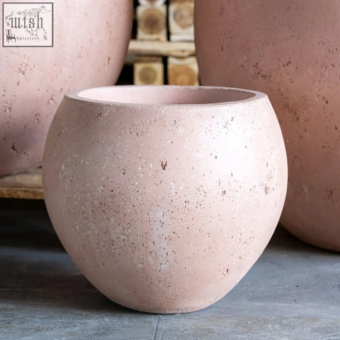 Orbello 35cm planter is a blush-pink terracotta round pot with a speckled textured surface and slightly flared rim