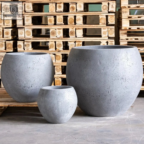 Set of three gray orbello onyx dusk concrete sphere planters with pigmented cement finish for small trees