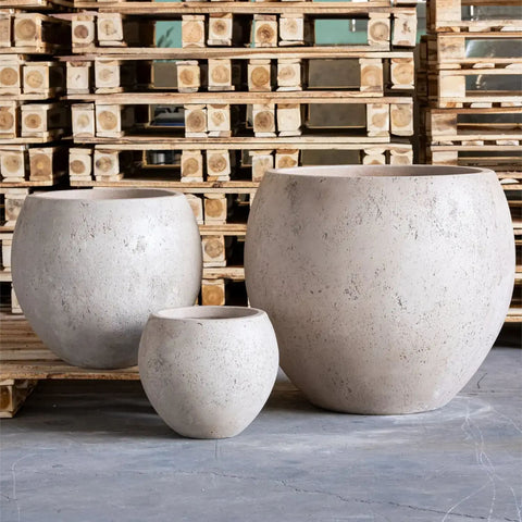 Three textured truffle concrete sphere planters in varying sizes perfect as round plant pots or concrete plant pots
