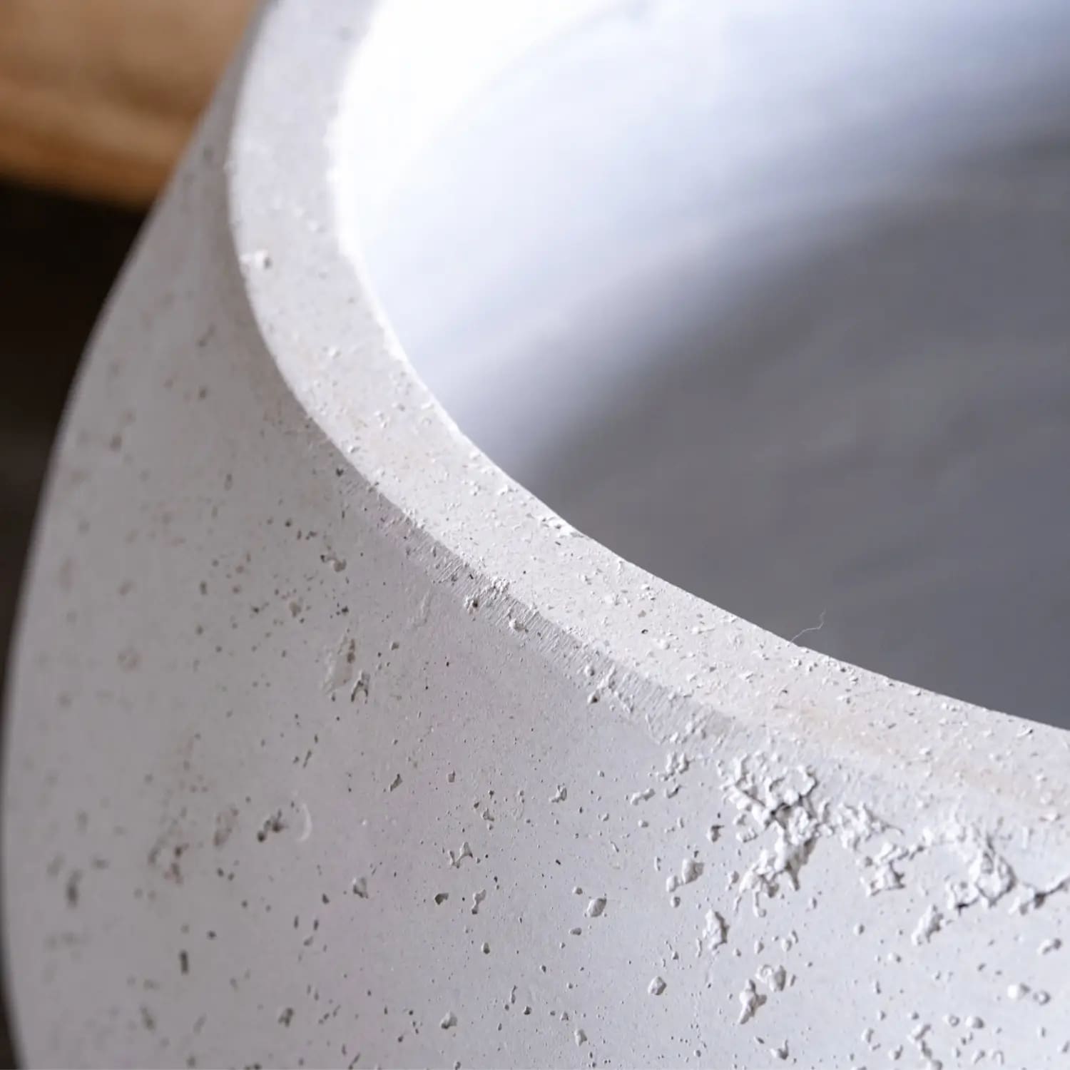 White mist orbello sphere planter made of speckled concrete with smooth rounded rim and 3l capacity plant pot