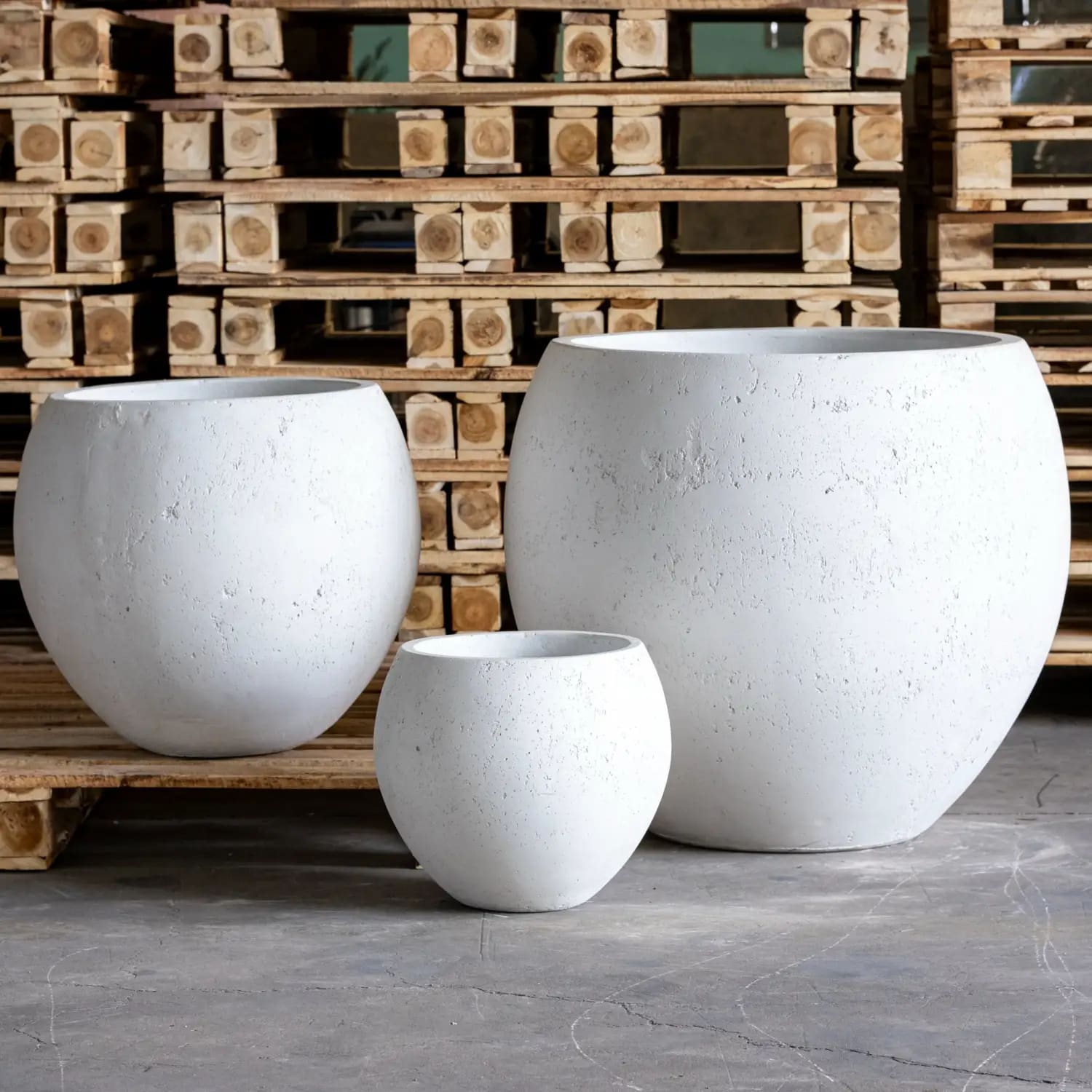 White mist orbello sphere planter made of textured concrete in varying sizes perfect for indoor plants
