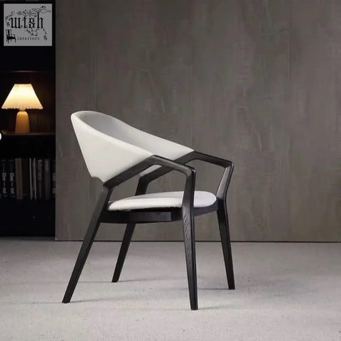 Modern white nīsu home orego chair with sleek black wooden frame and leather upholstery minimalist design