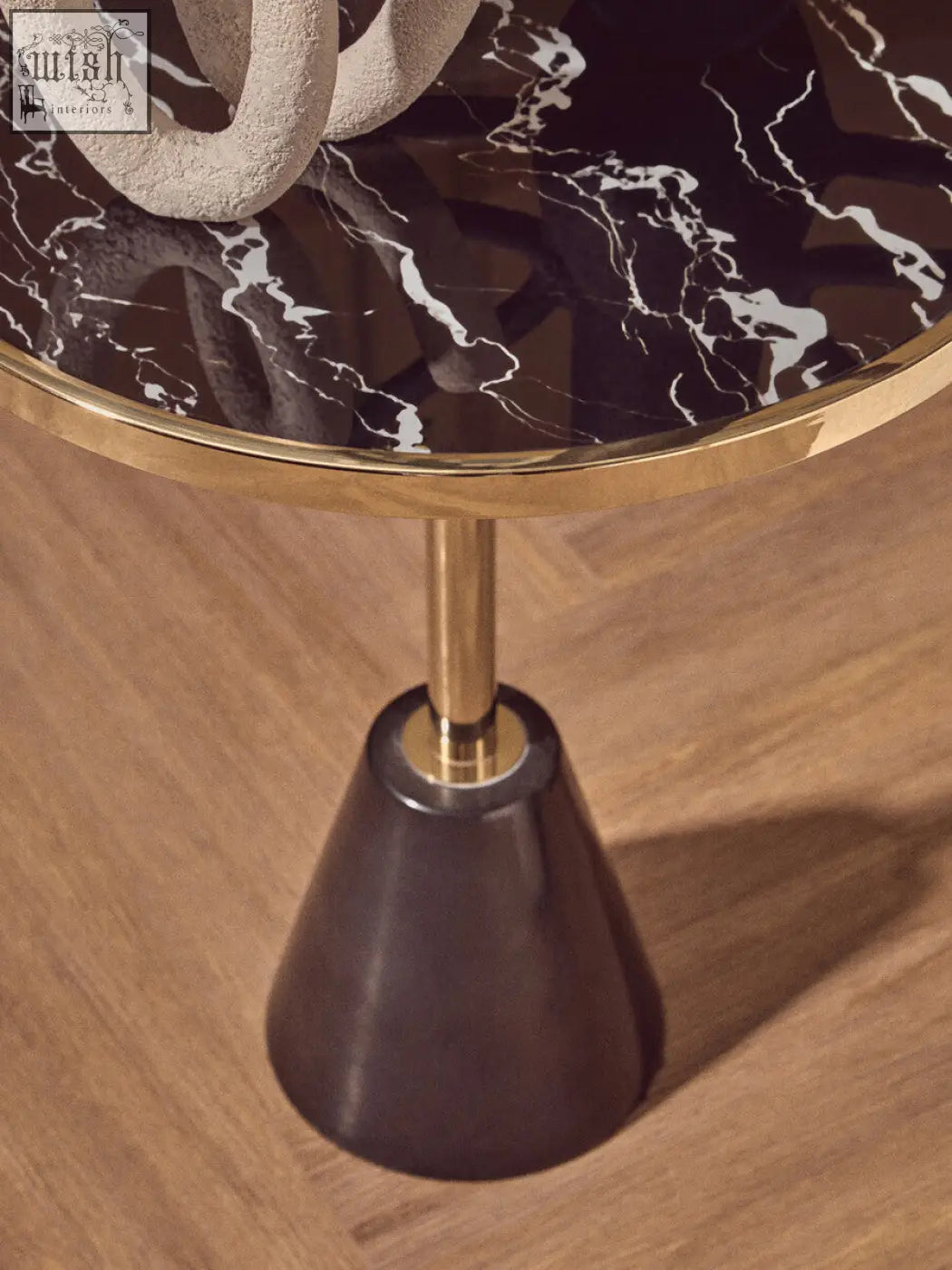 Oria black glass side table with sleek black and white marble base gold rim and slender brass stem design