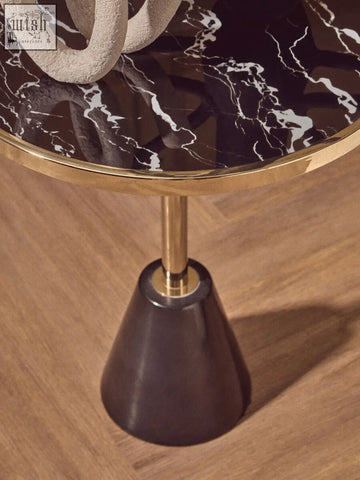 Oria black glass side table with sleek black and white marble base gold rim and slender brass stem design