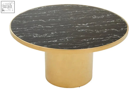A sleek oria black marble coffee table with a round black marble effect top and polished gold base