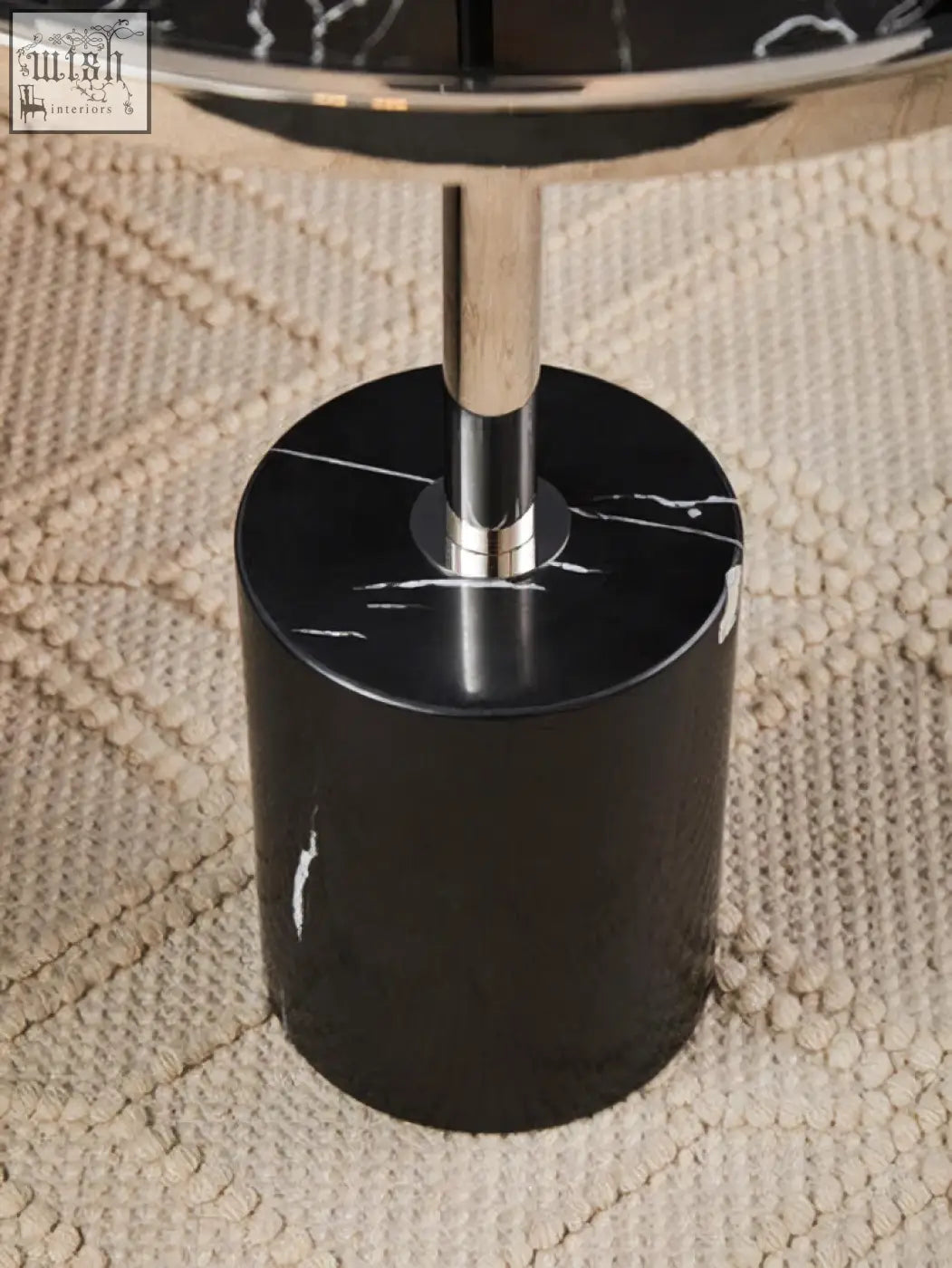 Oria black marble end table with a black marble base, stainless steel silver accents, and a polished chrome top