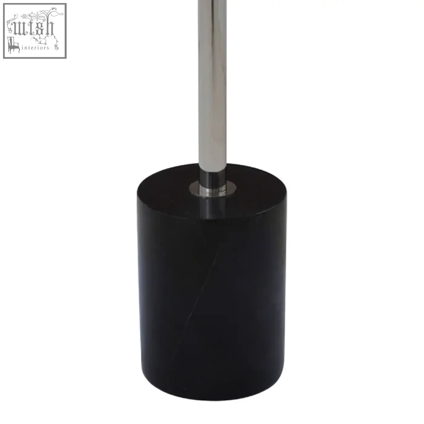 Black cylindrical toilet brush holder with polished chrome handle next to oria black marble end table with stainless steel base