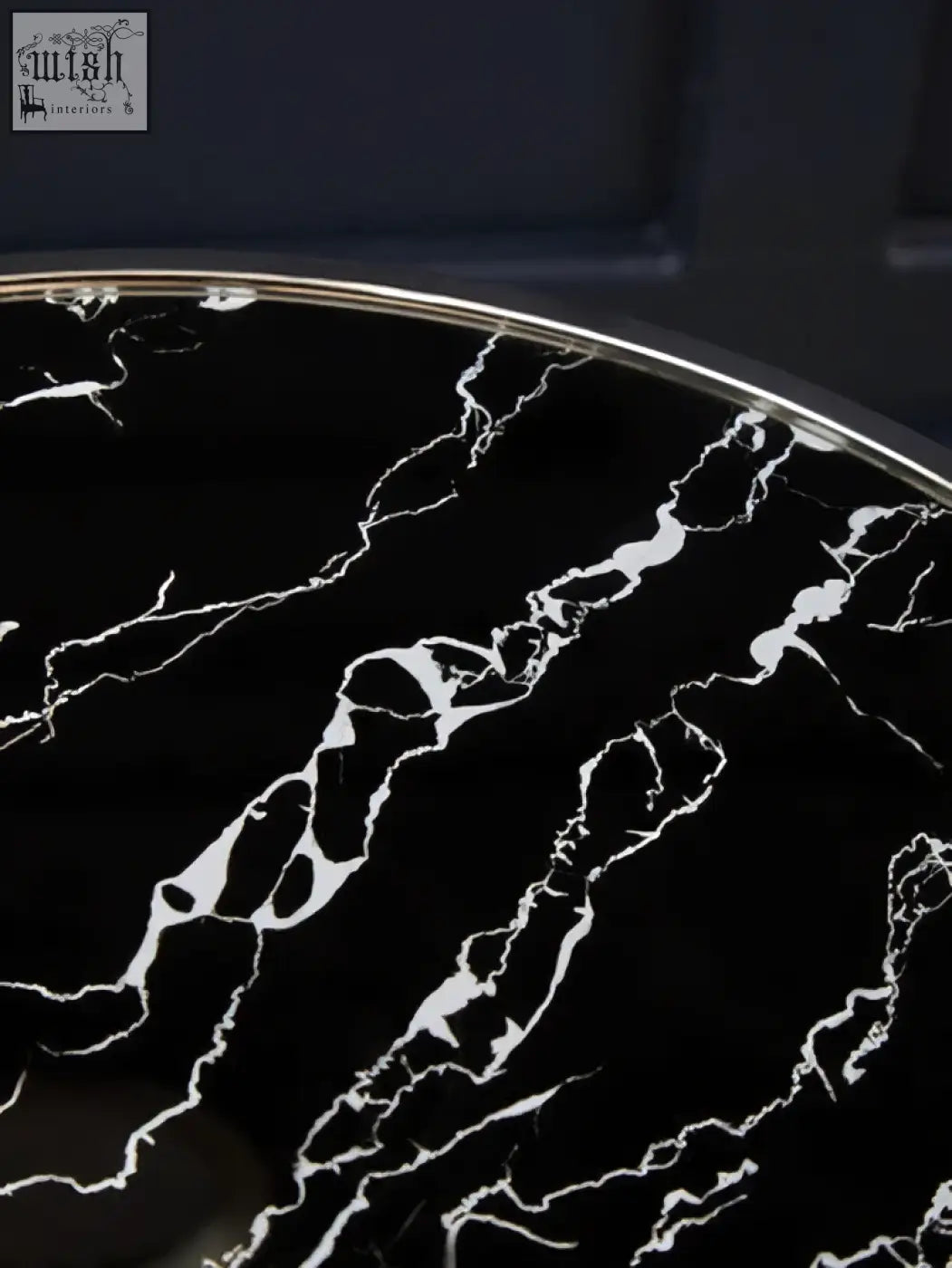 Oria black marble end table with a sleek black marble top and polished stainless steel rim for stylish living spaces