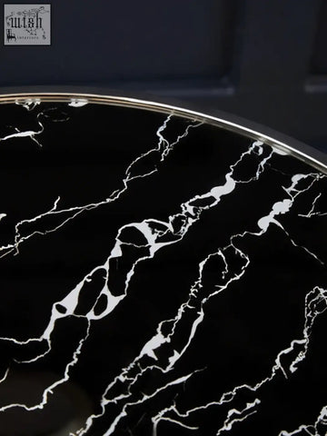 Oria black marble end table with a sleek black marble top and polished stainless steel rim for stylish living spaces