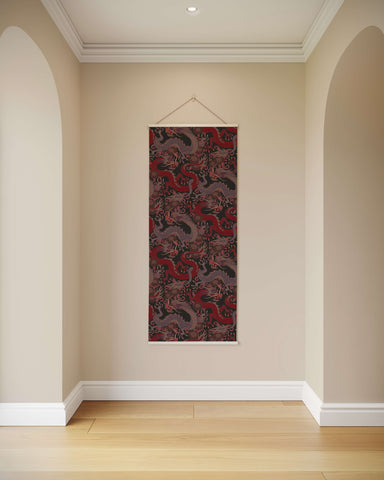 A vertically hanging oriental dragon tapestry with intricate red and black dragon motifs on a dark background