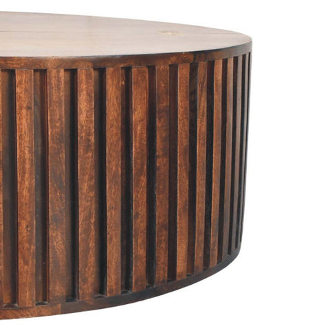 Rounded orion slatted coffee table with dark brown vertical wooden slats and smooth light-colored top surface