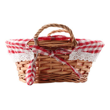 A charming round willow bread basket with red gingham lining and delicate lace trim tied with a matching bow