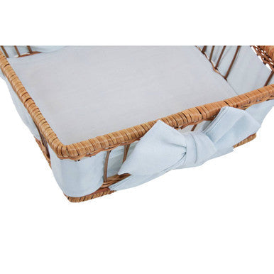 Woven rattan fern baskets with soft white cushion and decorative light blue bow perfect for baby use