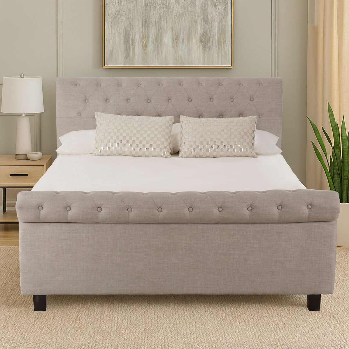 Gray tufted upholstered light grey ottoman king bed with matching footboard and dark wooden legs for cozy sleep