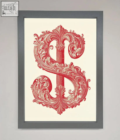 A framed print of ornate dollar cash art featuring a red baroque-style dollar sign on a cream background