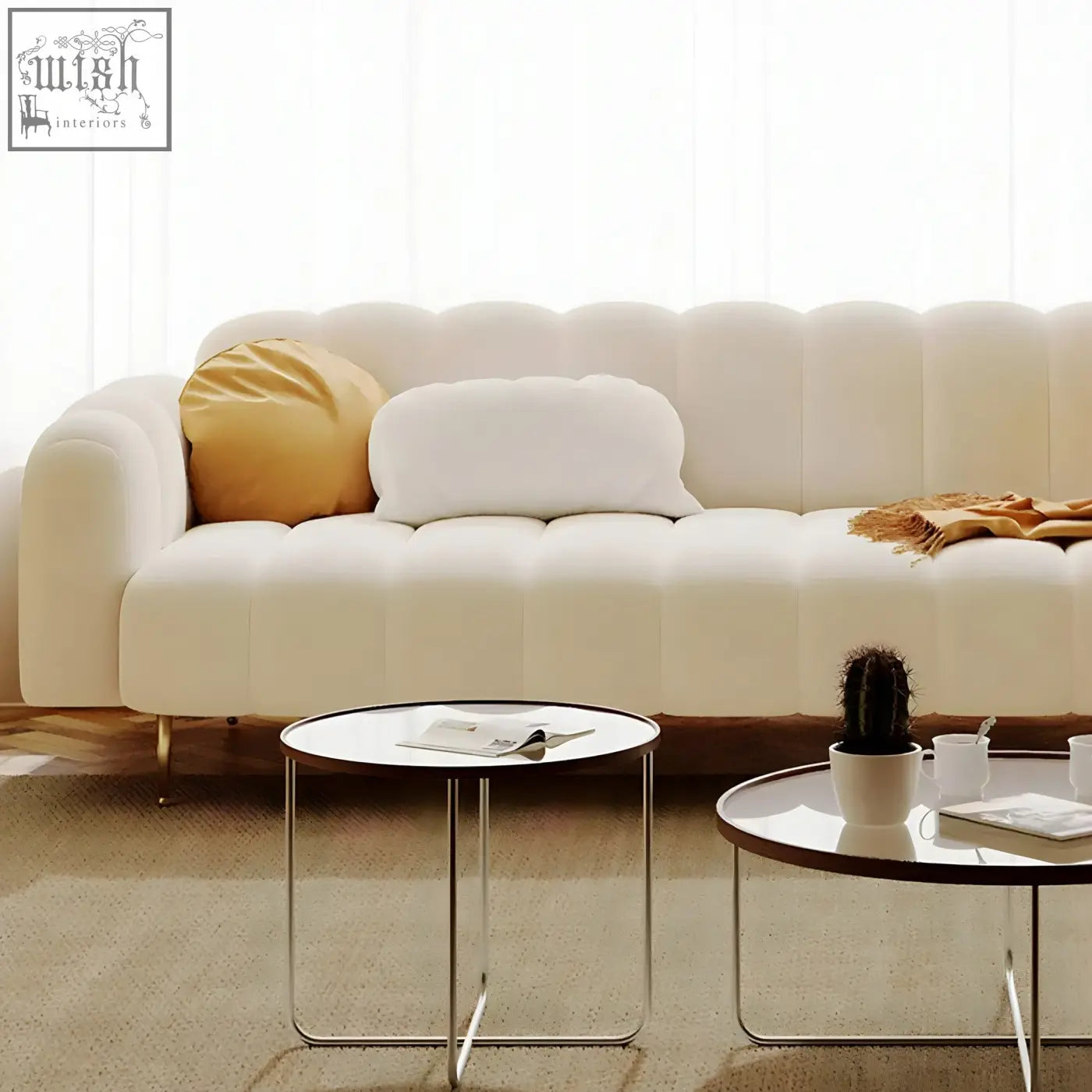 Cream-colored osamu sofa with tufted plush texture and rounded armrests perfect for a modern designer living room