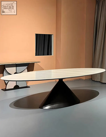 Osim oval dining table with a sleek white marble top and dark sculptural conical base perfect for modern oval dining