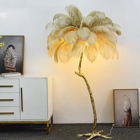 Golden ostrich feather floor lamp with tree-like base and cascading cream feathers for living room decor