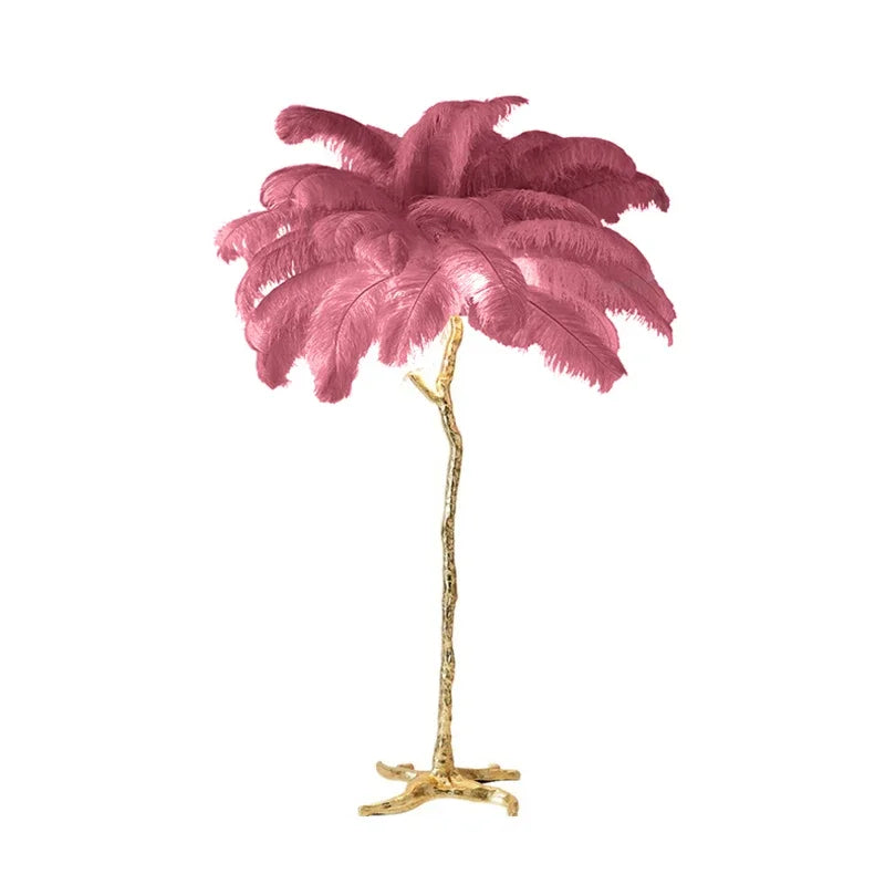 A tall floor lamp with a copper resin base and vibrant pink ostrich feather shade perfect for bedside lighting