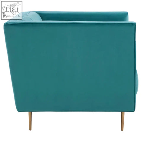 Teal velvet otylia green armchair with slender wooden legs perfect for cozy living spaces