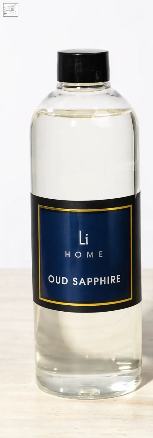 Clear glass reed diffuser refill bottle with black cap navy blue label gold trim for lifestyle home oud sapphire