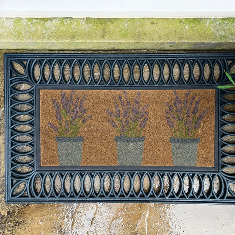 Black-framed outdoor lavender coir doormat with cork center featuring three purple lavender plants in gray pots