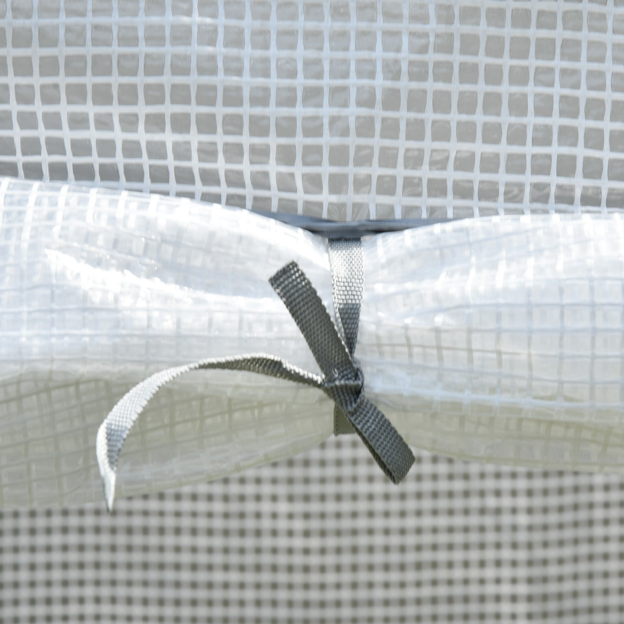 White translucent plastic cover with gray fabric tie on outsunny mini greenhouse with steel frame for outdoor spaces