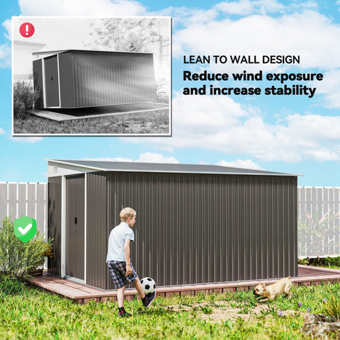 Gray metal garden storage shed with double sliding doors and lean to design for outdoor tool storage