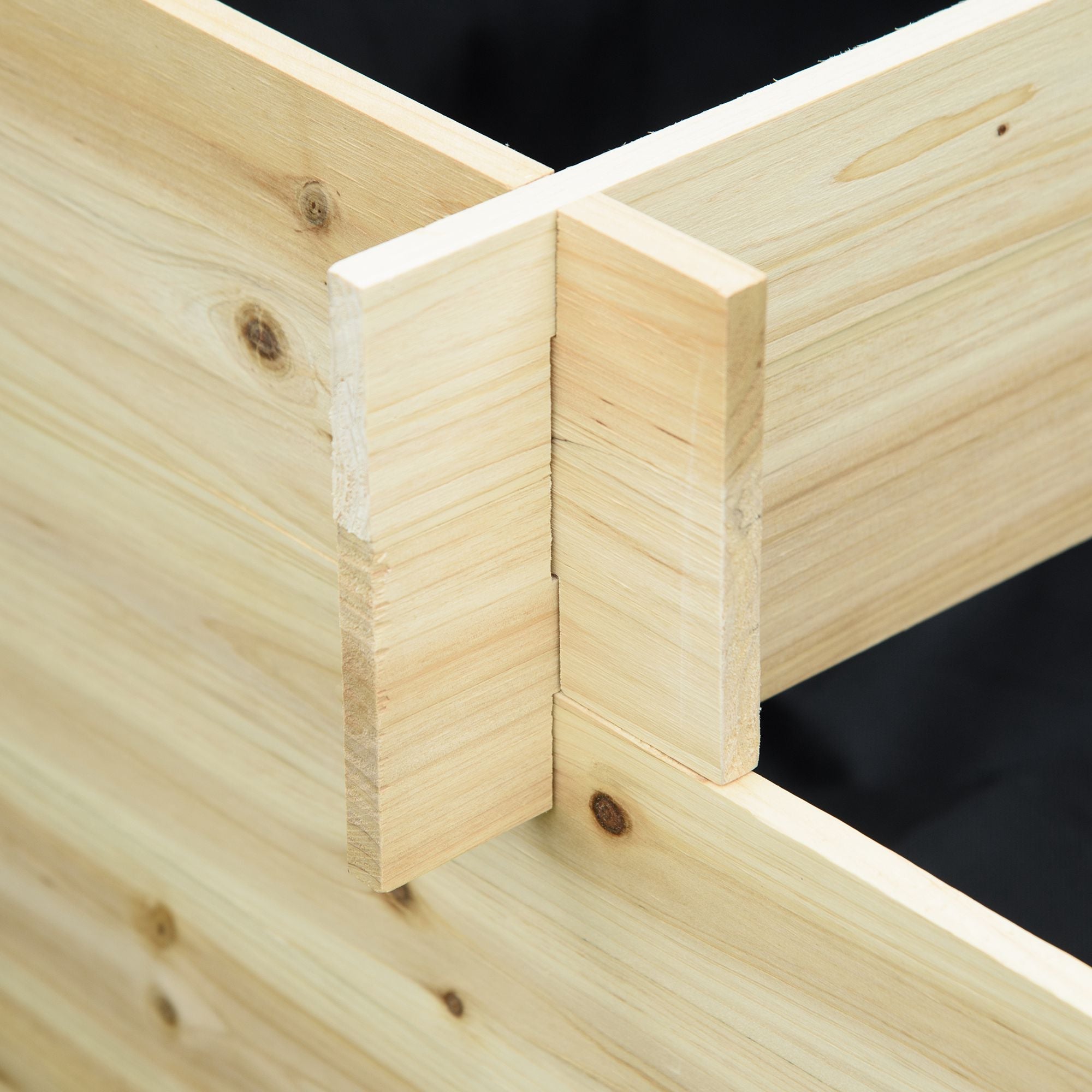 Light-colored fir wood corner joint with natural knots on outsunny 105l x 29w raised garden bed frame