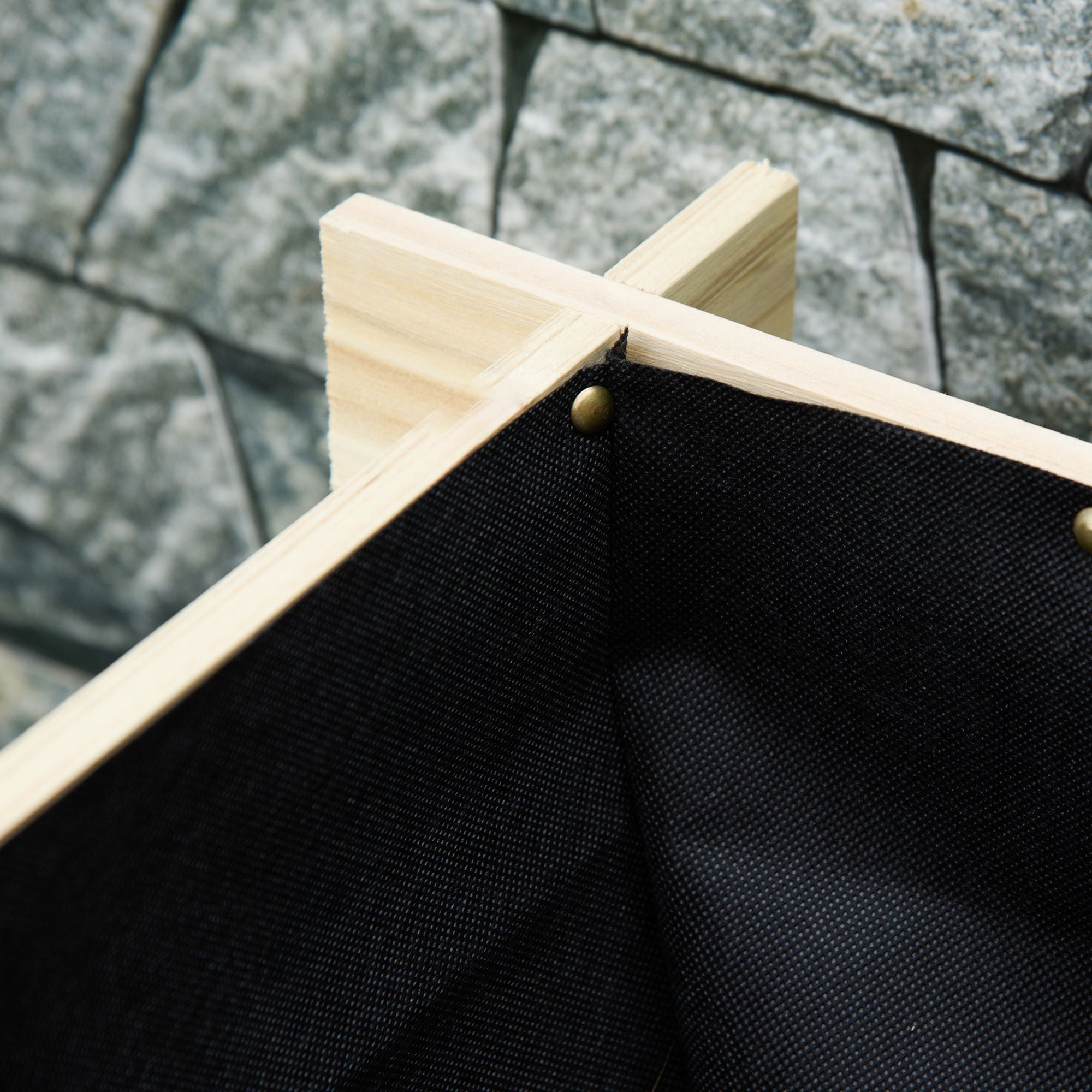 Black canvas fabric with brass rivets framed by light fir wood beams on a 105l x 29w raised garden planter box