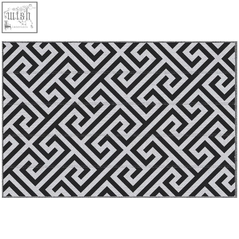 Black and silver geometric outdoor rug with woven plastic straw texture perfect for road tour camping and garden use