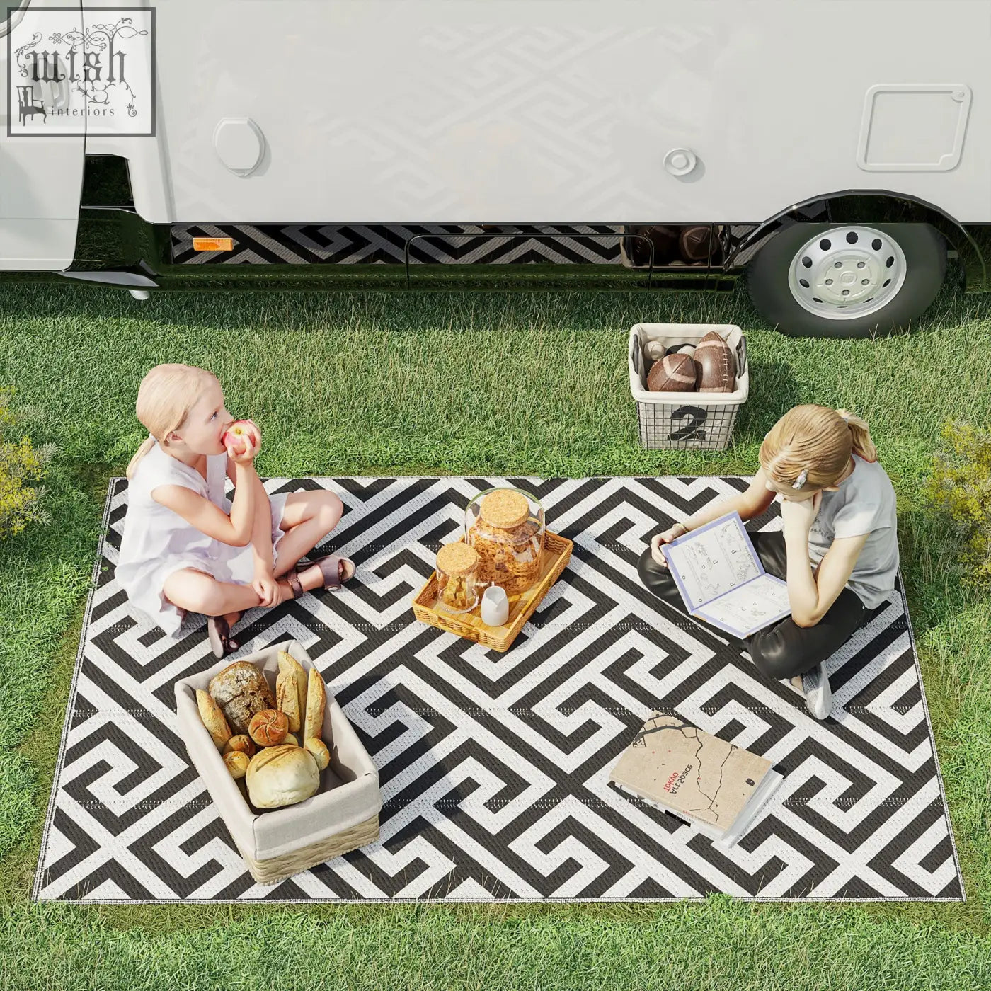 Black and white geometric patterned outdoor rug made of plastic straw perfect for road tour picnic or camping use