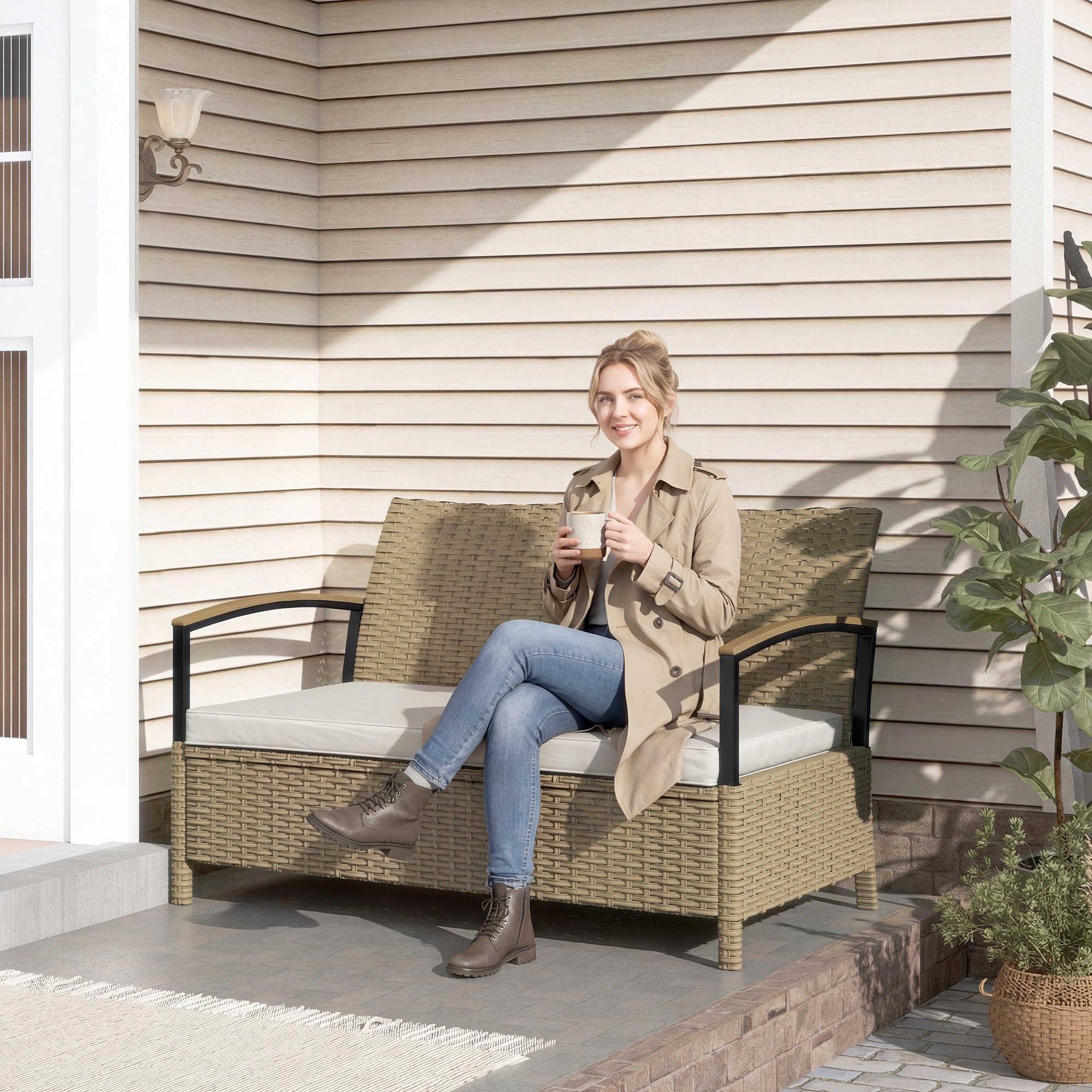 Beige wicker outdoor sofa with black metal arms and white cushion in outsunny 125l garden storage bench for two seating