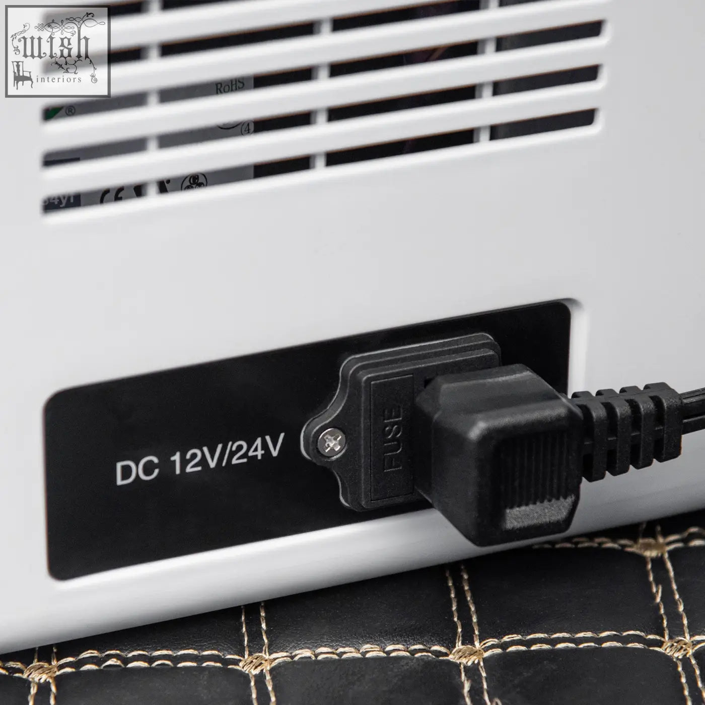 White plastic electric heater with black power plug and fuse labeled dc 12v 24v for portable refrigerator foldable handles