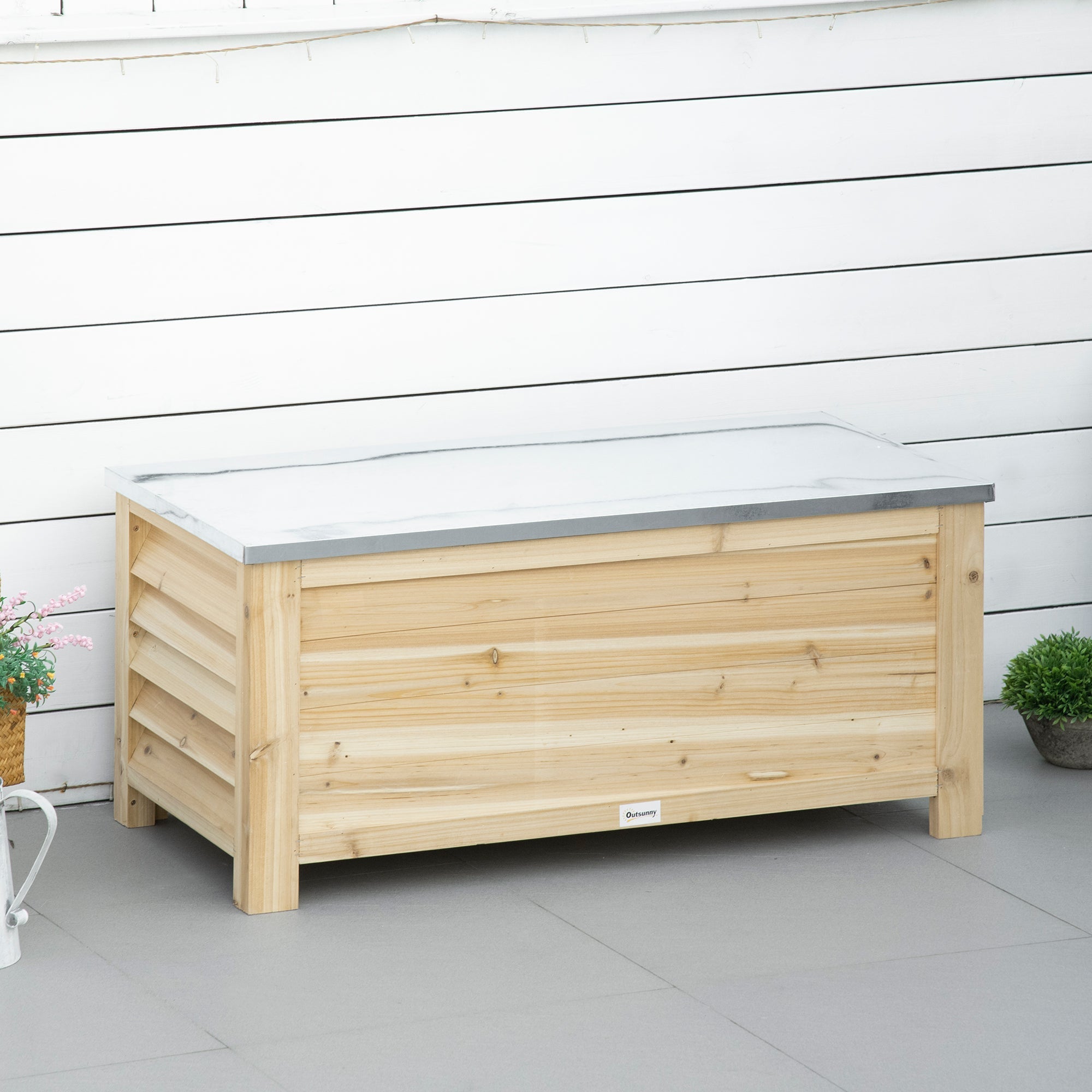 Light wooden outdoor storage box with white marble-effect galvanised metal top for garden and terrace use
