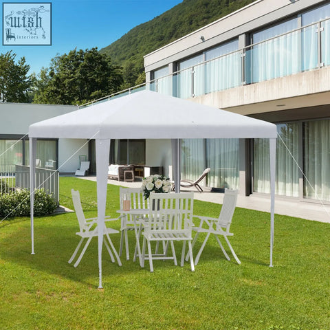 White pop-up gazebo with steel frame, guy ropes, and ground stakes for outdoor garden party or wedding canopy use
