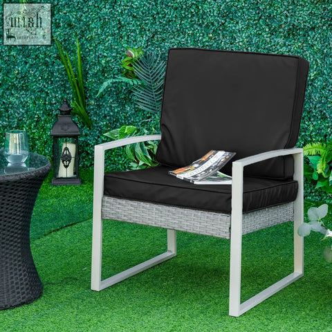 Gray wicker outdoor armchair with black seat cushion and back pad featuring polyester fabric covers for outdoor seat use