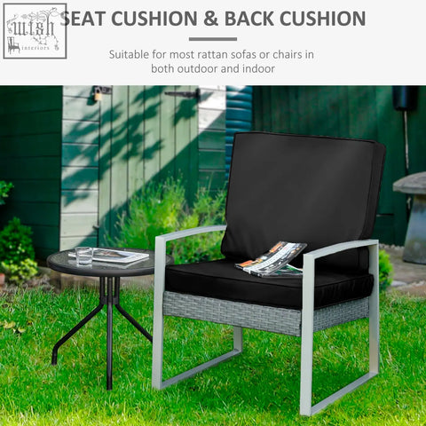 Black seat and back cushion set with polyester fabric covers for outdoor seat on gray wicker rattan chair