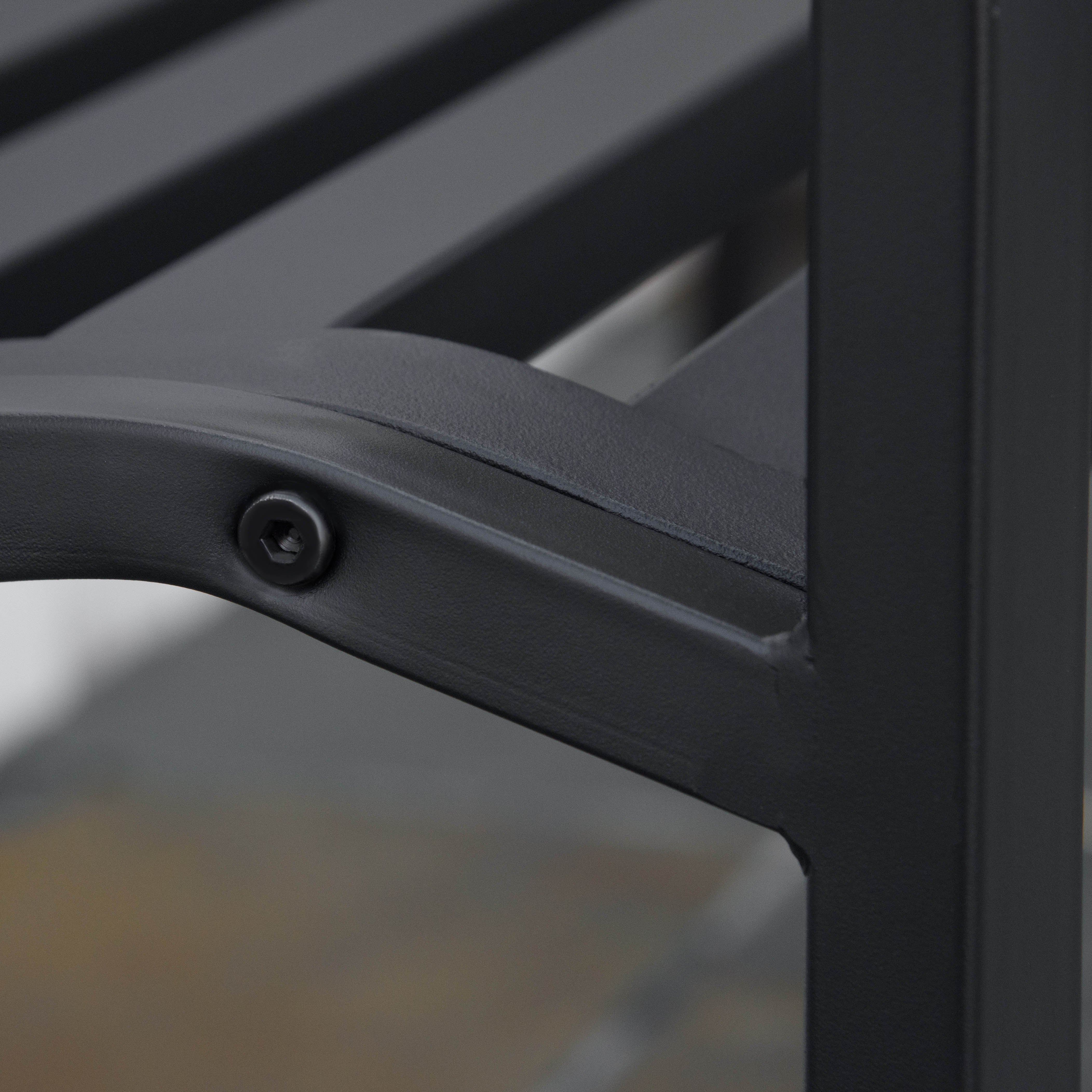 Black metal garden bench frame with slatted seating and curved arm in cast iron for yard patio or porch use