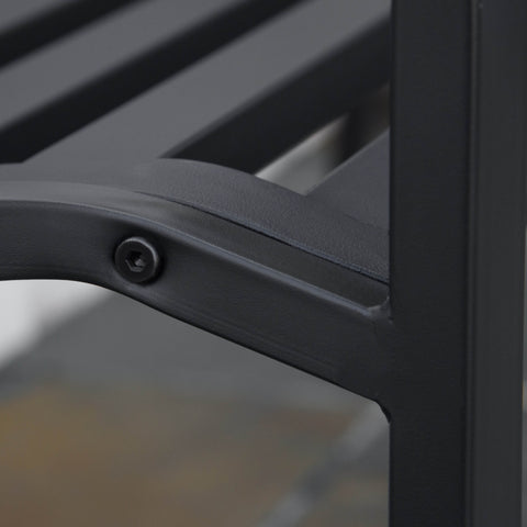 Black metal garden bench frame with slatted seating and curved arm in cast iron for yard patio or porch use