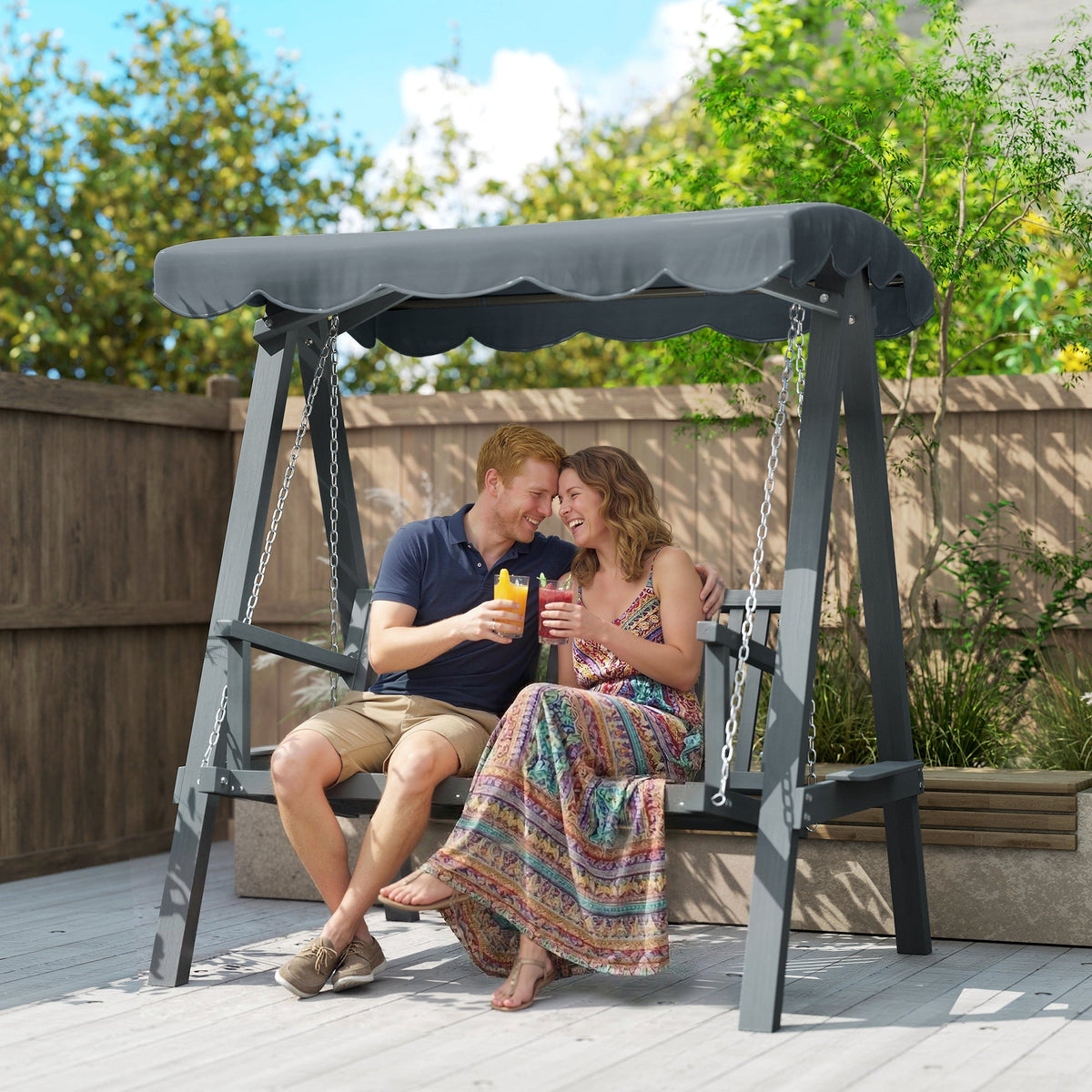 Dark gray metal swing chair outdoor with scalloped canopy and chain suspension for garden swings and patio use