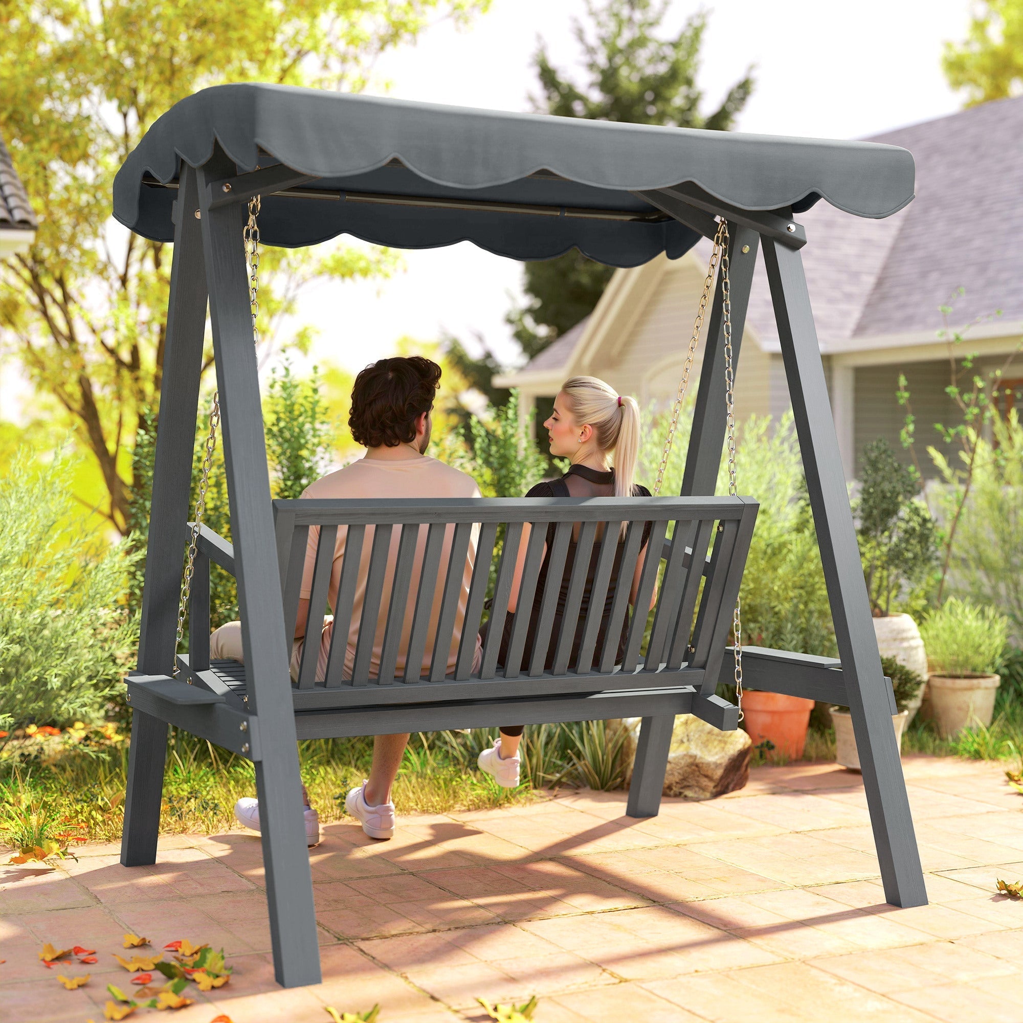 Gray wooden double swing chair outdoor with scalloped canopy and chain suspension perfect for garden swings
